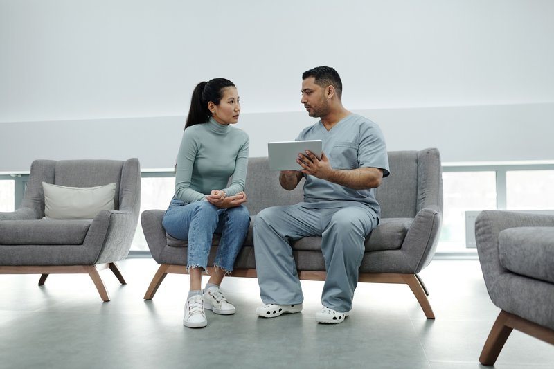 Doctor having a warm consultation with a patient