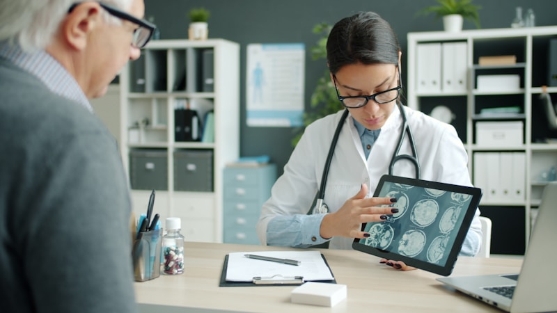 Chiropractor discussing findings and recommendations with a patient