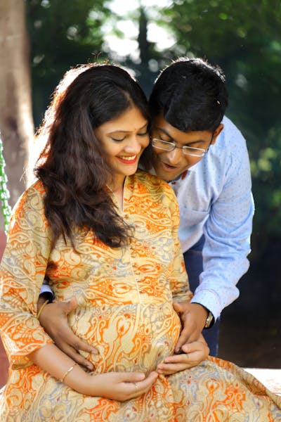 Happy expecting couple embracing the pregnancy journey together