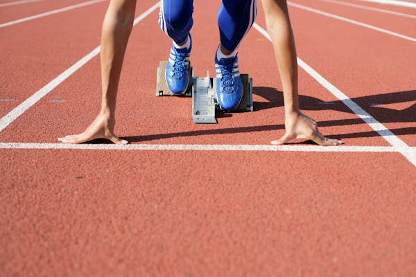 Athlete in starting position on the track